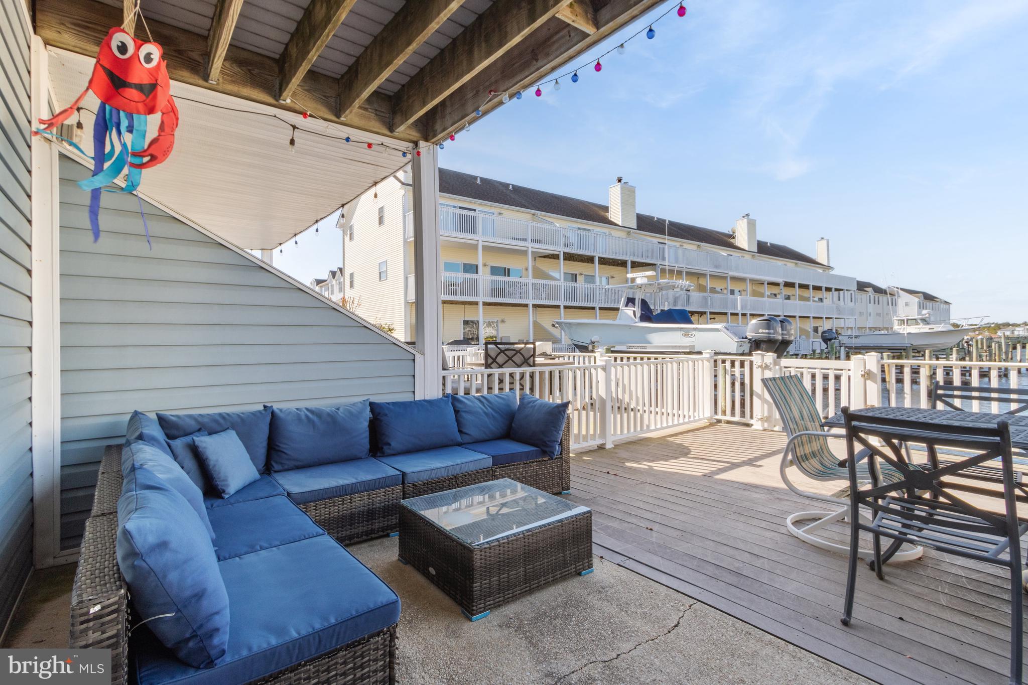 37896 Marina Road, Unit 4 Ocean View, DE 19970 - Photo 50 of 78 a roof deck with couch and chairs