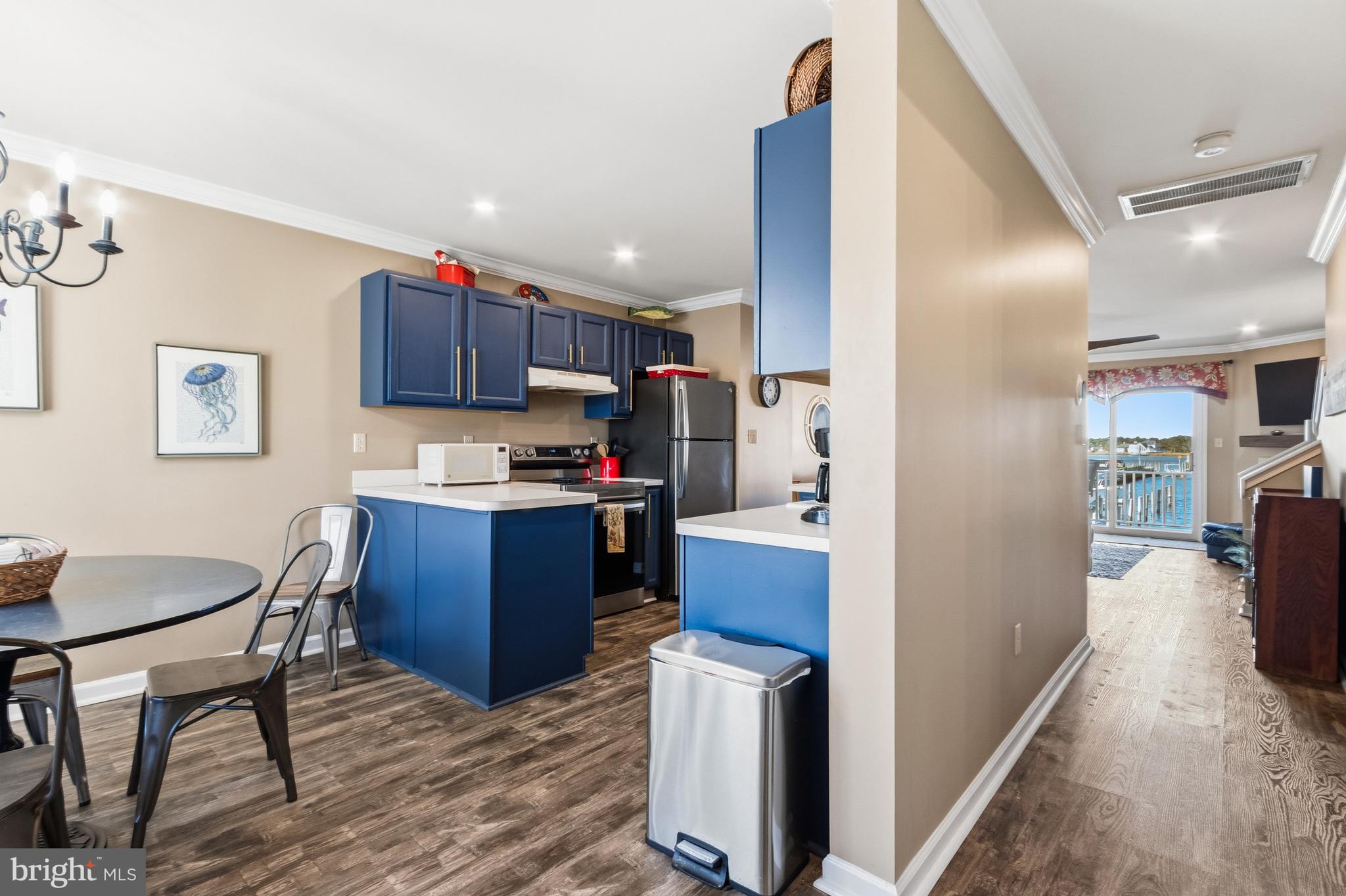 37896 Marina Road, Unit 4 Ocean View, DE 19970 - Photo 5 of 78 a kitchen with refrigerator and cabinets