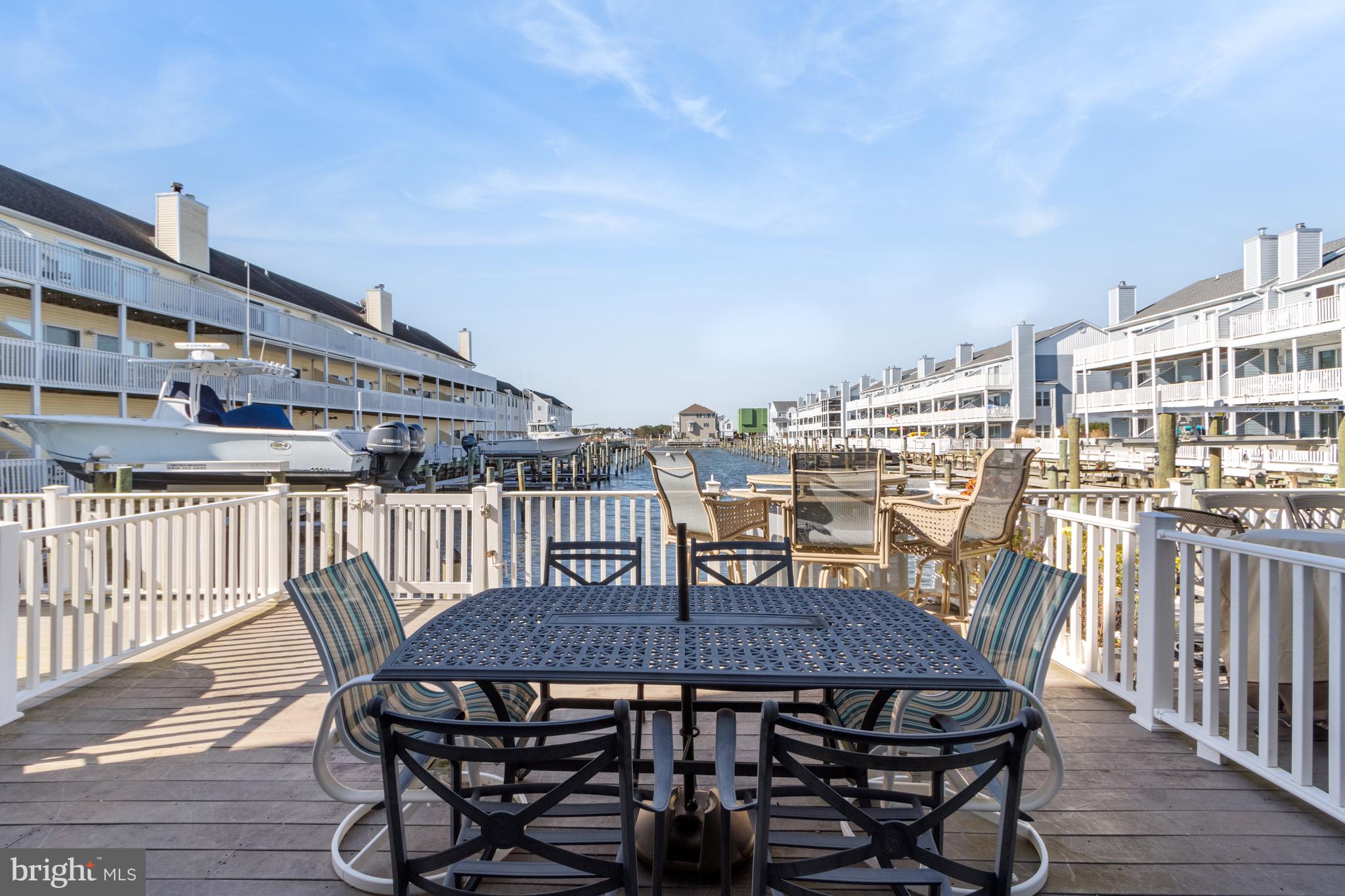 37896 Marina Road, Unit 4 Ocean View, DE 19970 - Photo 52 of 78 a view of a roof deck with table and chairs