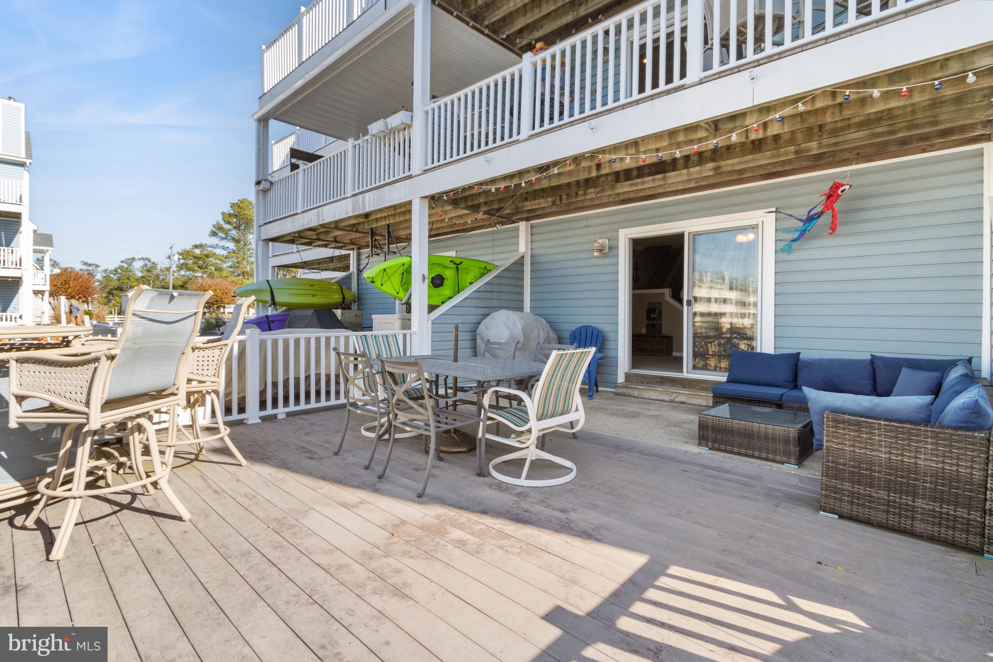 37896 Marina Road, Unit 4 Ocean View, DE 19970 - Photo 53 of 78 a view of a patio with a table and chairs