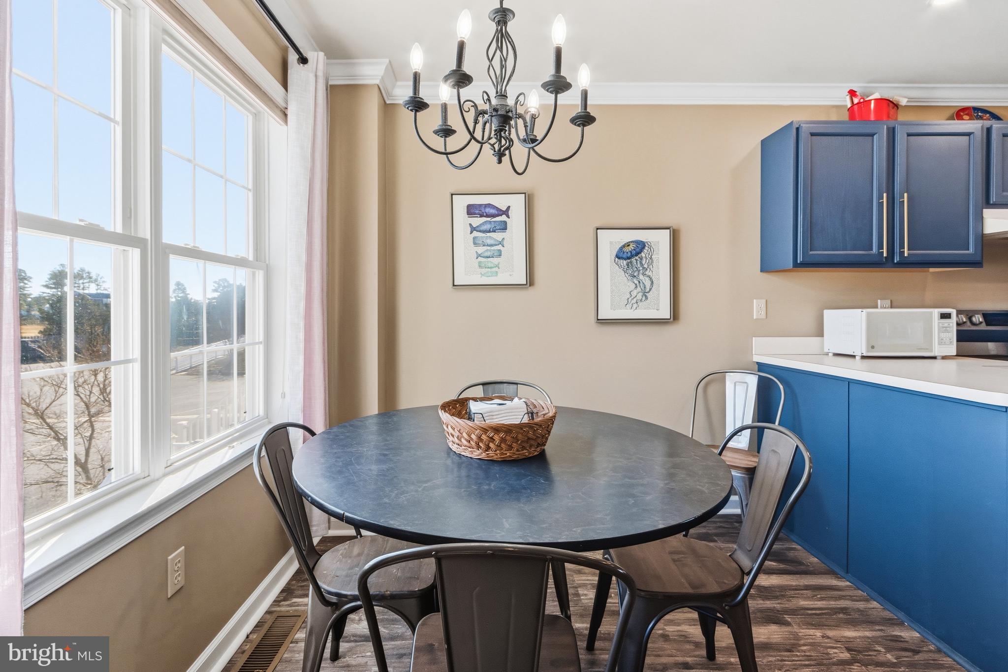 37896 Marina Road, Unit 4 Ocean View, DE 19970 - Photo 6 of 78 a view of a dining room with furniture window and wooden floor