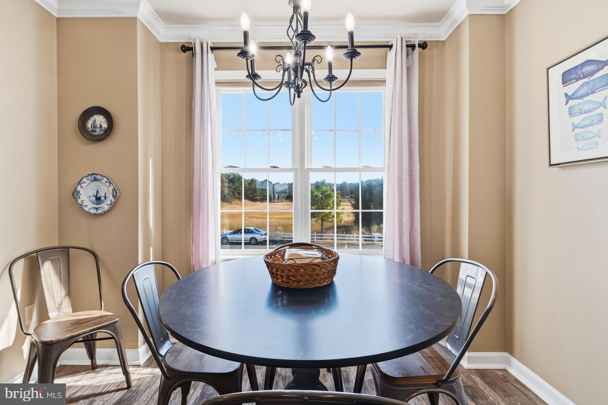 37896 Marina Road, Unit 4 Ocean View, DE 19970 - Photo 7 of 78 a view of a dining room with furniture and window