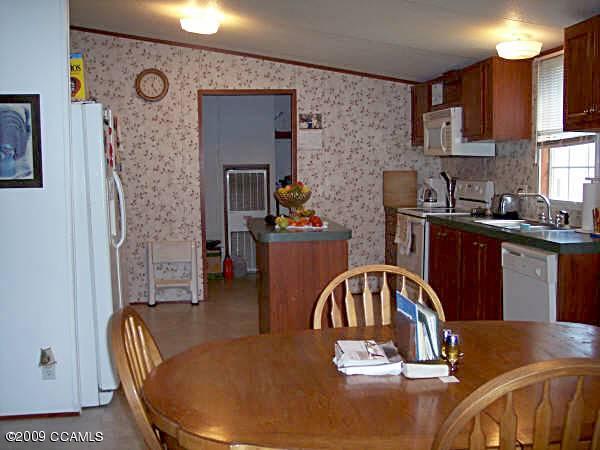 209 Hardesty Farm Road Newport, NC 28570 - Photo 4 of 9 Kitchen and Dining Area