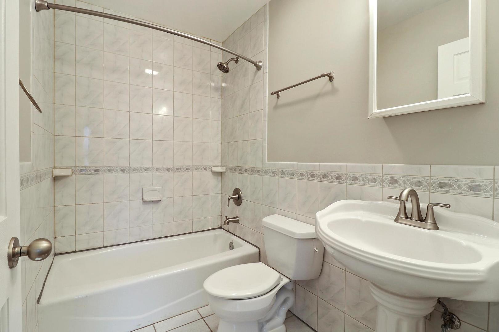 419 Foster Road Wauconda, IL 60084 - Photo 11 of 21 a bathroom with a sink toilet and shower