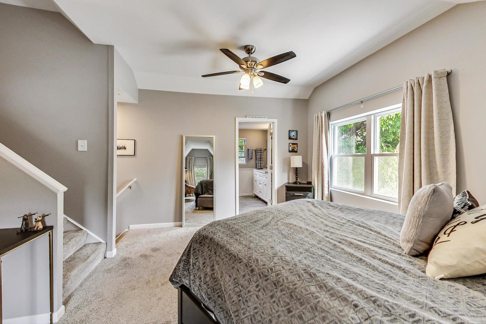 138 Northgate Road Riverside, IL 60546 - Photo 11 of 30 a bedroom with a bed and a large mirror with a flat tv screen