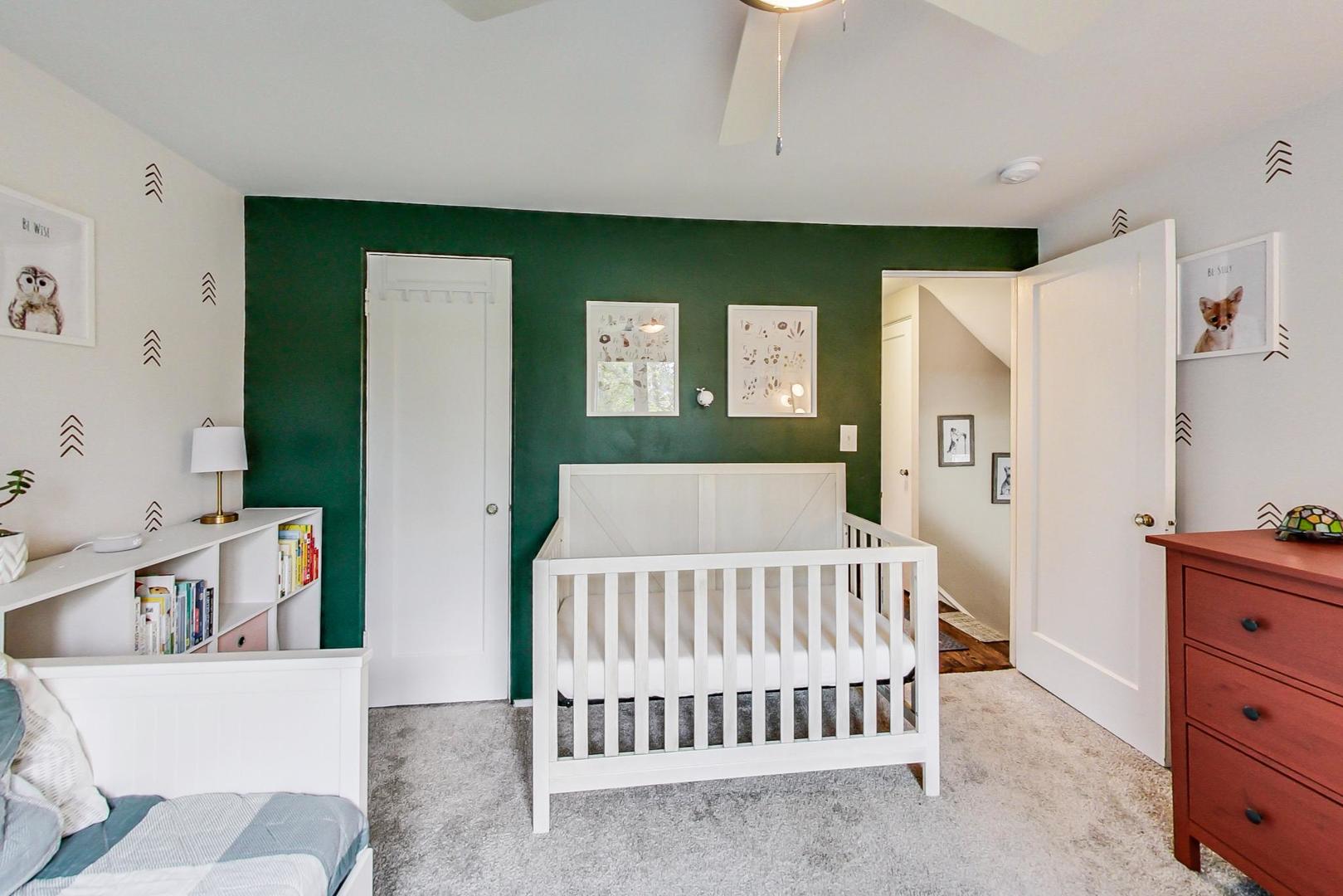 138 Northgate Road Riverside, IL 60546 - Photo 19 of 30 a bedroom with a bed and a baby crib