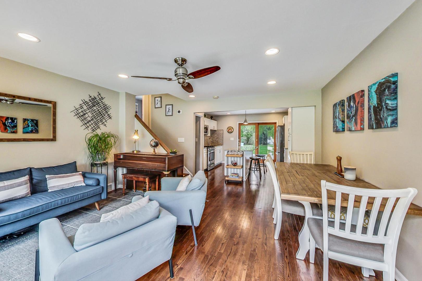 138 Northgate Road Riverside, IL 60546 - Photo 2 of 30 a living room with furniture a dining table and a piano