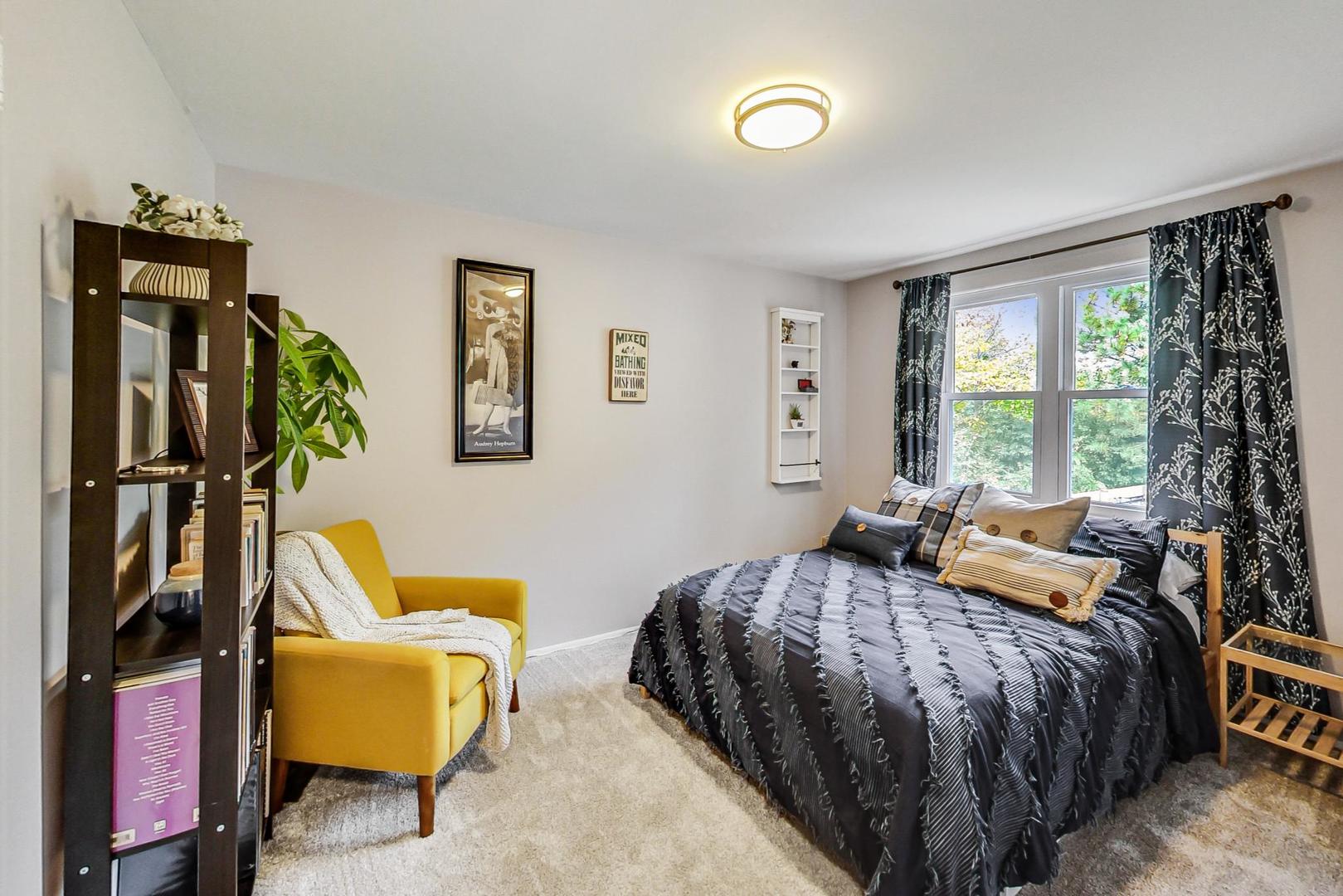 138 Northgate Road Riverside, IL 60546 - Photo 21 of 30 a bedroom with a bed a couch and a window