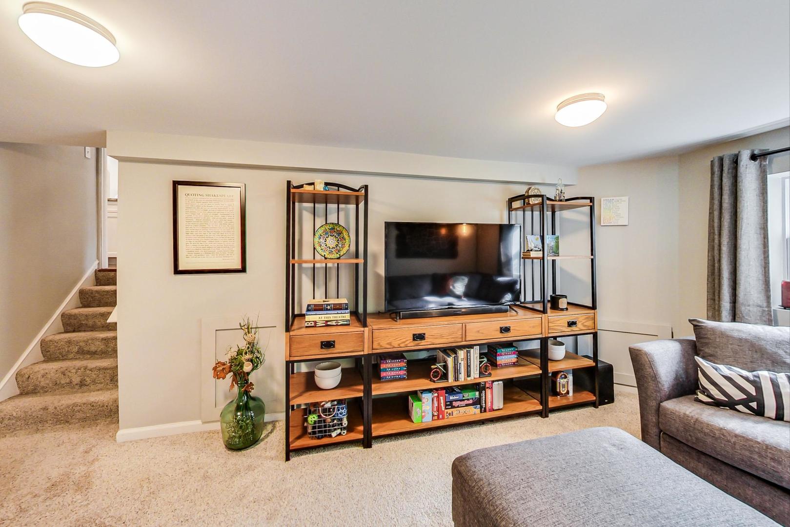 138 Northgate Road Riverside, IL 60546 - Photo 8 of 30 a living room with furniture and a flat screen tv