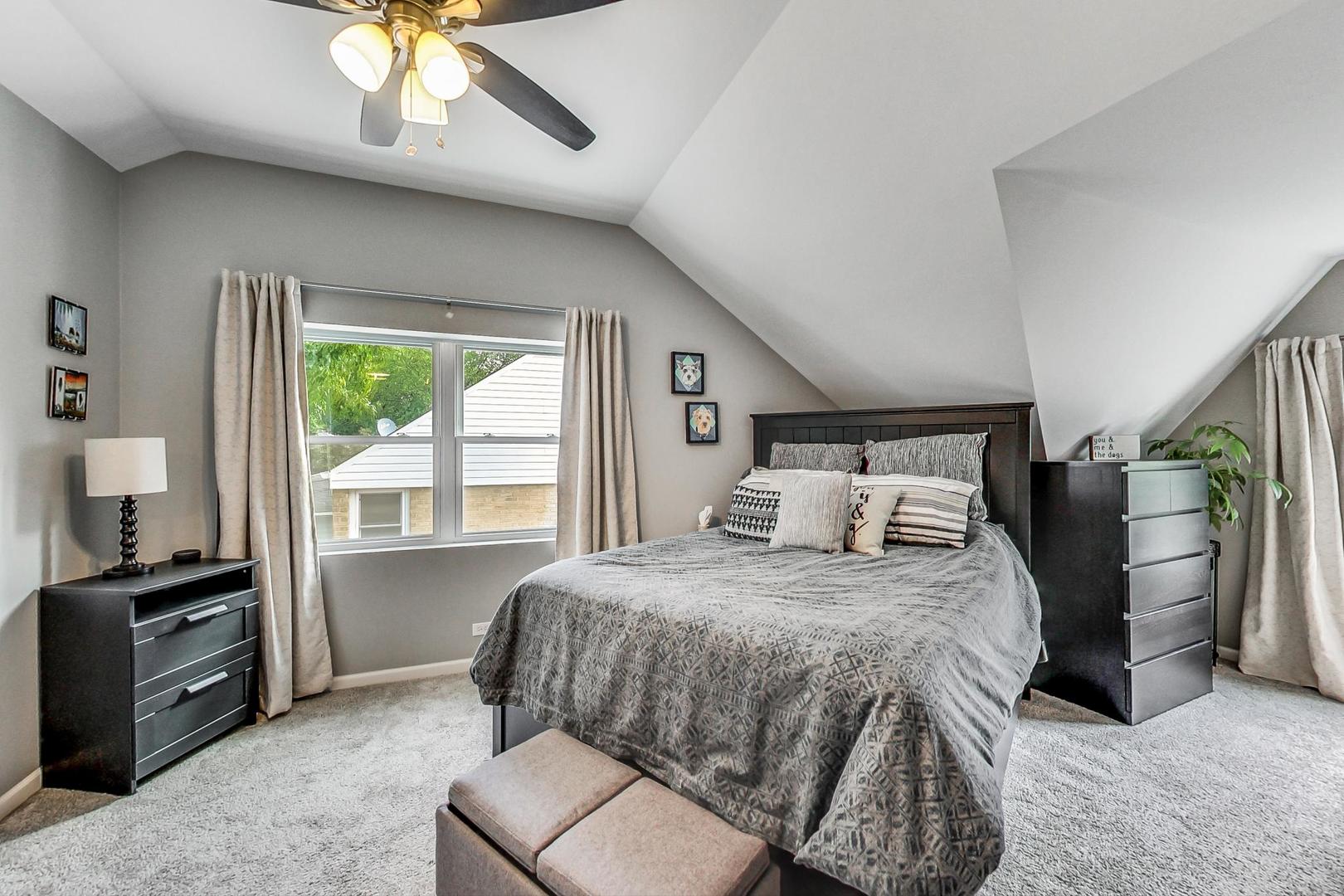 138 Northgate Road Riverside, IL 60546 - Photo 10 of 30 a bedroom with a bed and a chandelier