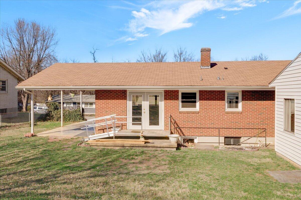 212 Cherryhill Road Northwest Roanoke, VA 24017 - Photo 17 of 30 a front view of a house with a yard glass top table and chairs