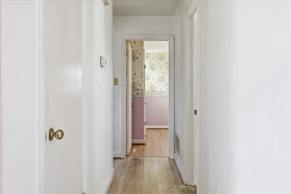 a view of a bathroom from the hallway