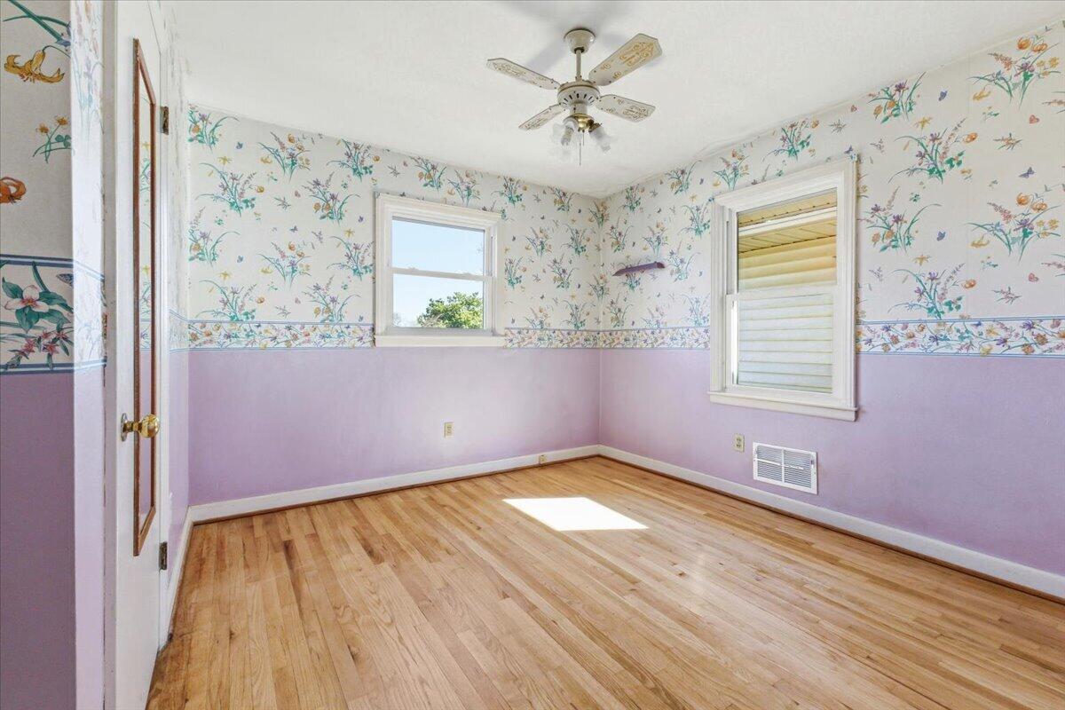 212 Cherryhill Road Northwest Roanoke, VA 24017 - Photo 21 of 30 wooden floor in an empty room with a window