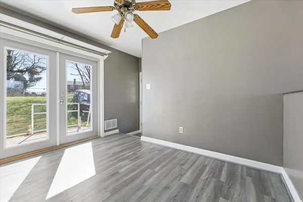 a view of an empty room with a window