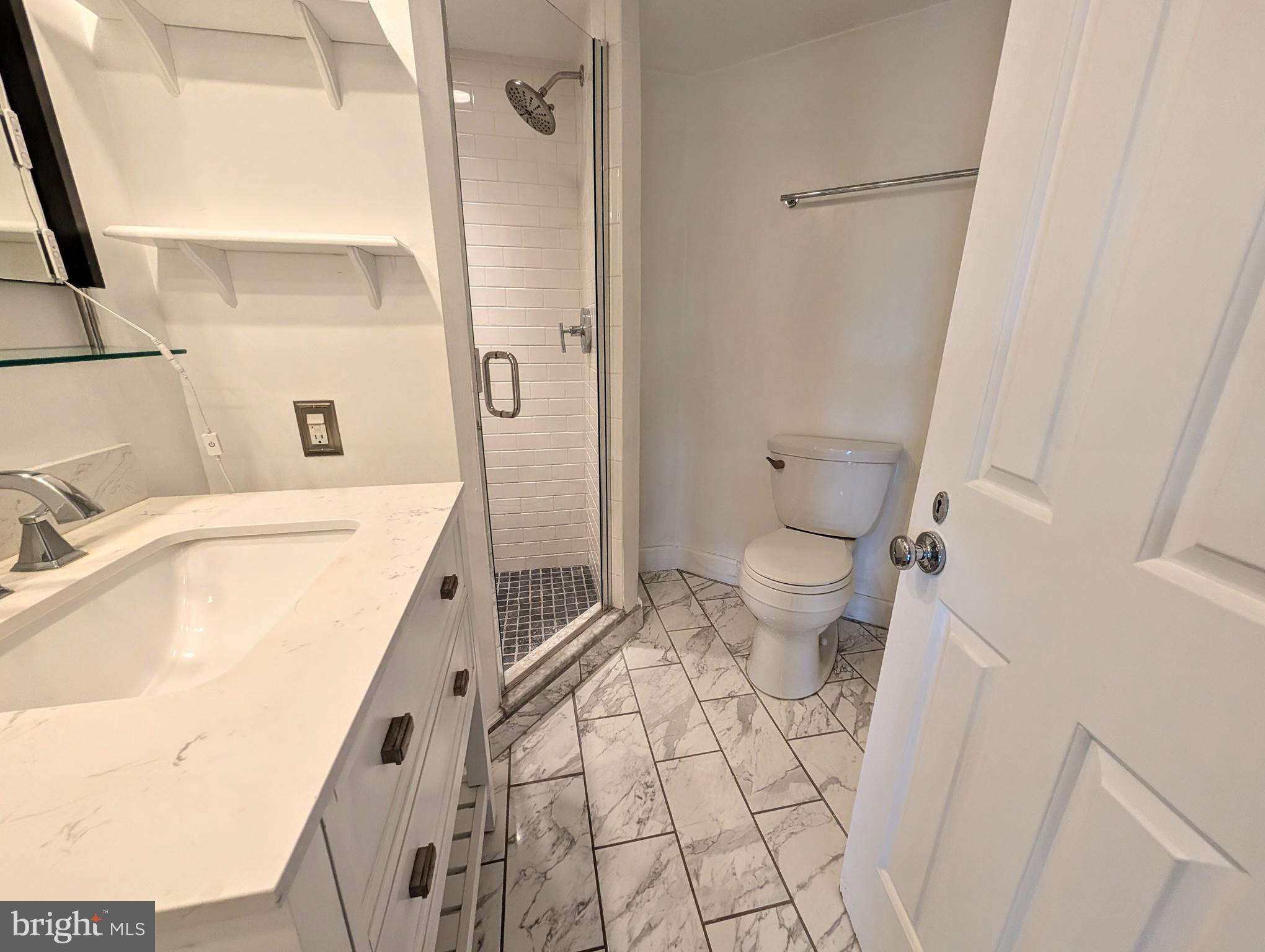 1080 Wisconsin Avenue Northwest, Unit 501 Washington, DC 20007 - Photo 18 of 36 a bathroom with a sink toilet and shower