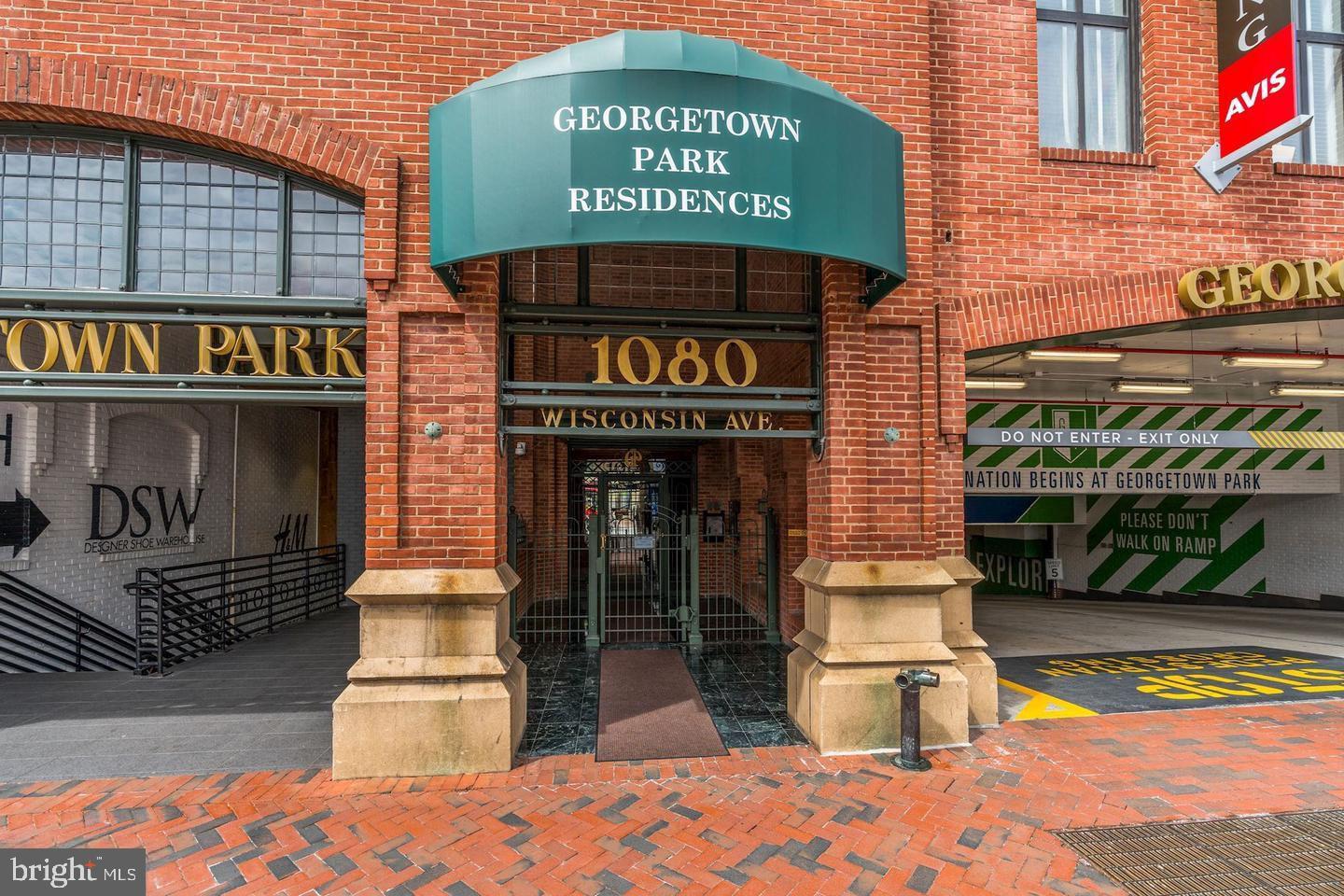 1080 Wisconsin Avenue Northwest, Unit 501 Washington, DC 20007 - Photo 2 of 36 a sign on the side of a building