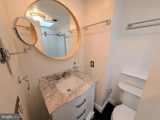 a bathroom with a shower and toilet
