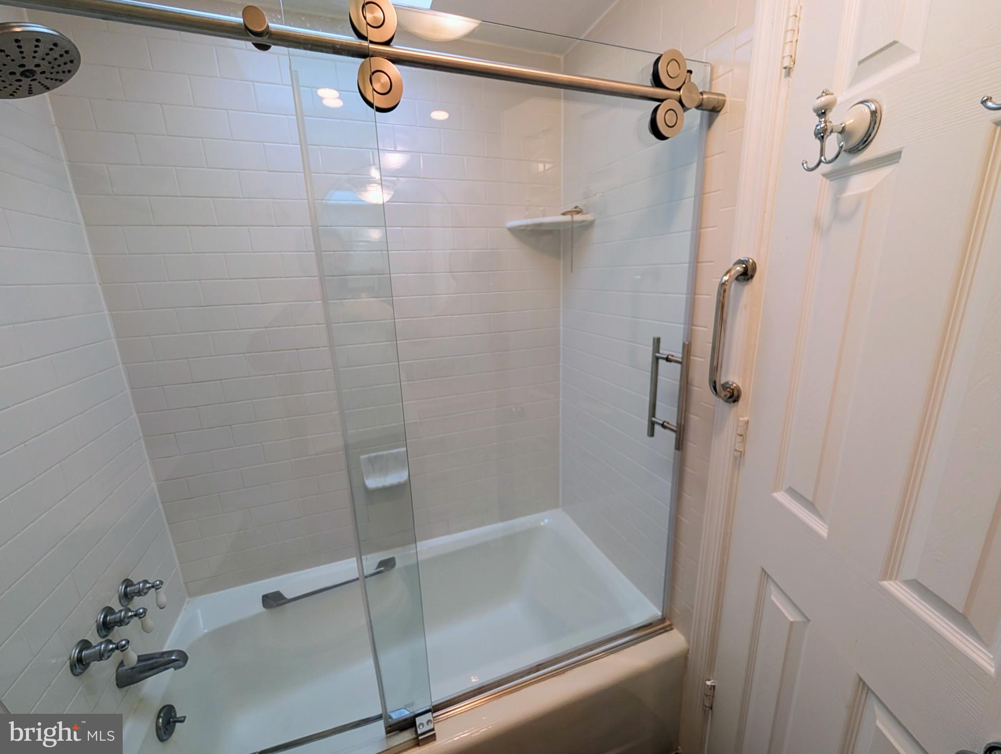 1080 Wisconsin Avenue Northwest, Unit 501 Washington, DC 20007 - Photo 26 of 36 a bathroom with a shower and toilet