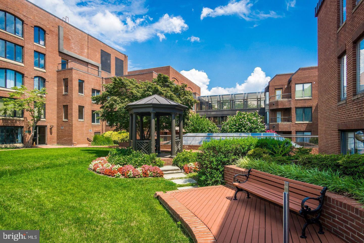 1080 Wisconsin Avenue Northwest, Unit 501 Washington, DC 20007 - Photo 28 of 36 a view of a house with backyard and sitting area