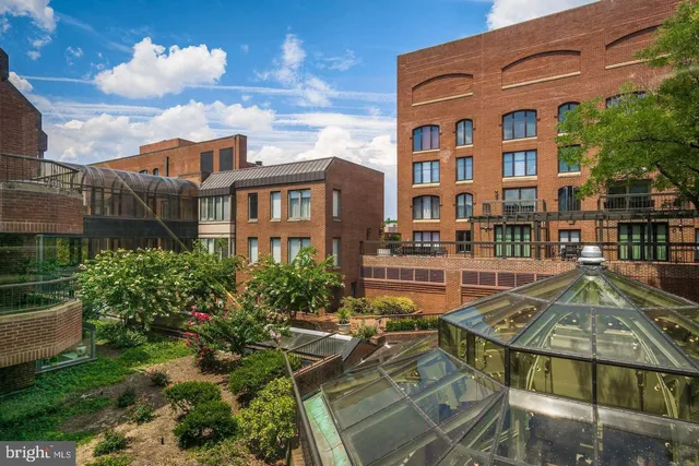 a front view of a building with glass windows
