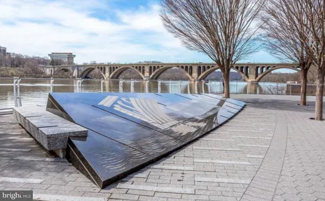 a view of a house with backyard and porch