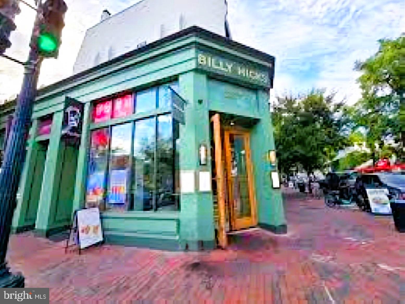 1080 Wisconsin Avenue Northwest, Unit 501 Washington, DC 20007 - Photo 32 of 36 a view of a house with backyard and porch