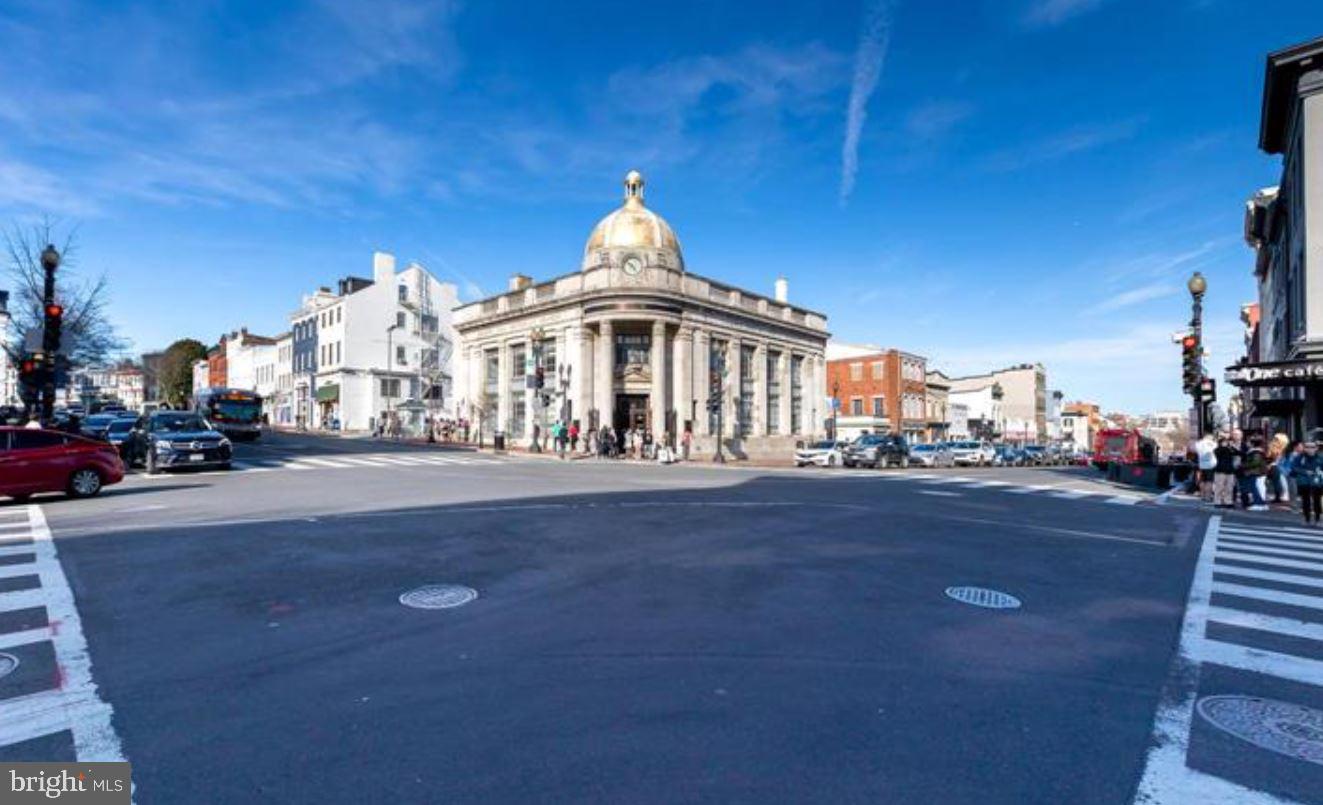 1080 Wisconsin Avenue Northwest, Unit 501 Washington, DC 20007 - Photo 36 of 36 a front view of a house with a yard