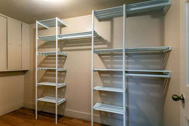 a bathroom with a mirror and a shower