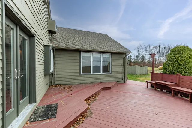 a view of a house with yard and a garden
