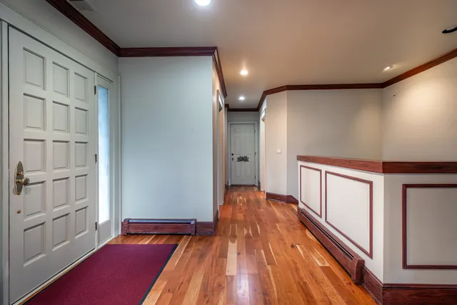 a view of gallery with wooden floor