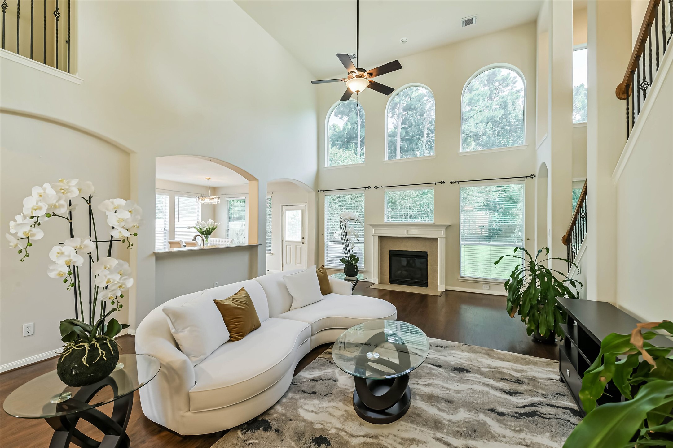 8718 Rolling Rapids Road Humble, TX 77346 - Photo 12 of 34 Spacious 2 story living room with fireplace & lots of natural light