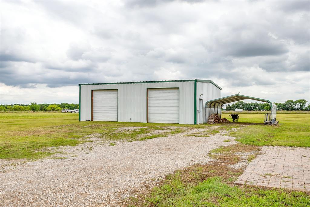 1050 Hampel Road Palmer, TX 75152 - Photo 5 of 35 a view of a house with a yard and garage