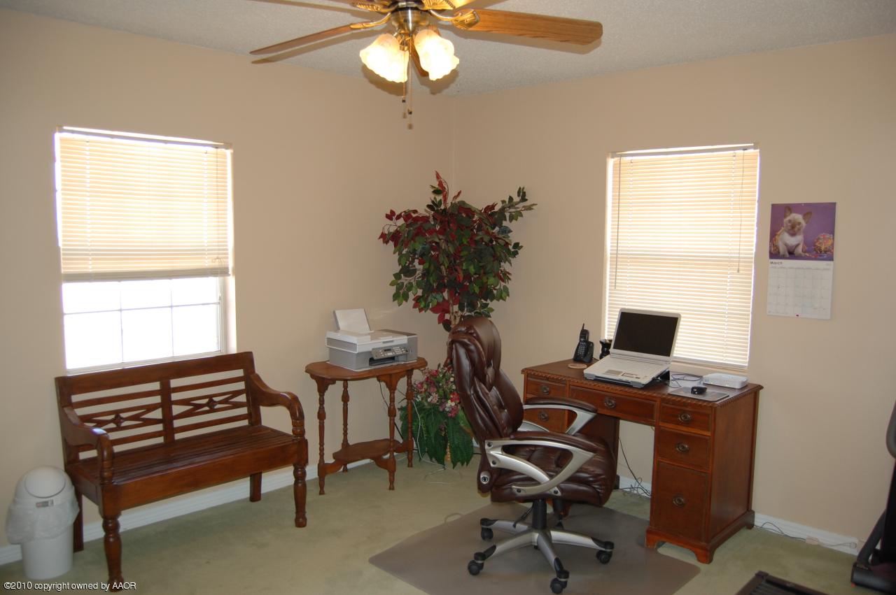 6706 Hatton Road Amarillo, TX 79110 - Photo 18 of 23 a view of a workspace with furniture and a window