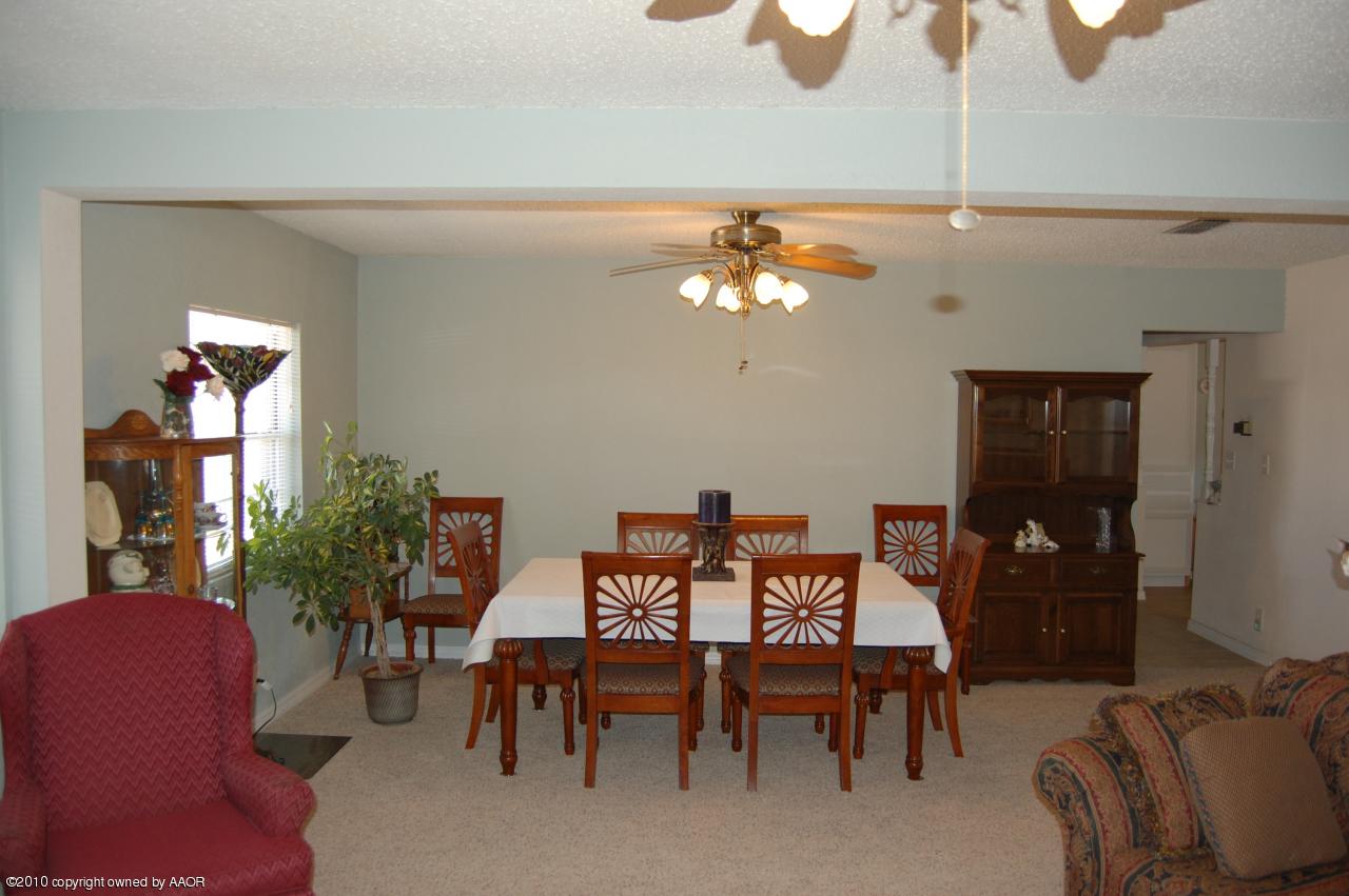 6706 Hatton Road Amarillo, TX 79110 - Photo 10 of 23 a view of a dining room with furniture and chandelier