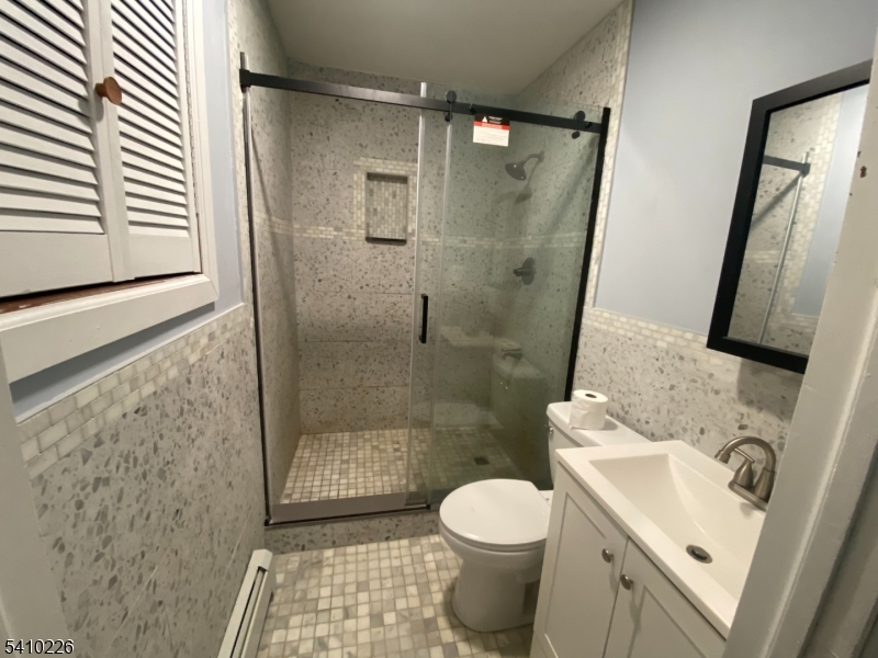 17 Walnut Terrace Bloomfield, NJ 07003 - Photo 11 of 12 a bathroom with a sink toilet and shower