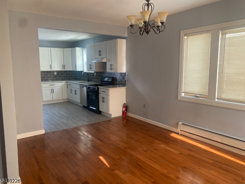 17 Walnut Terrace Bloomfield, NJ 07003 - Photo 5 of 12 a kitchen with stainless steel appliances granite countertop a stove a sink and a refrigerator