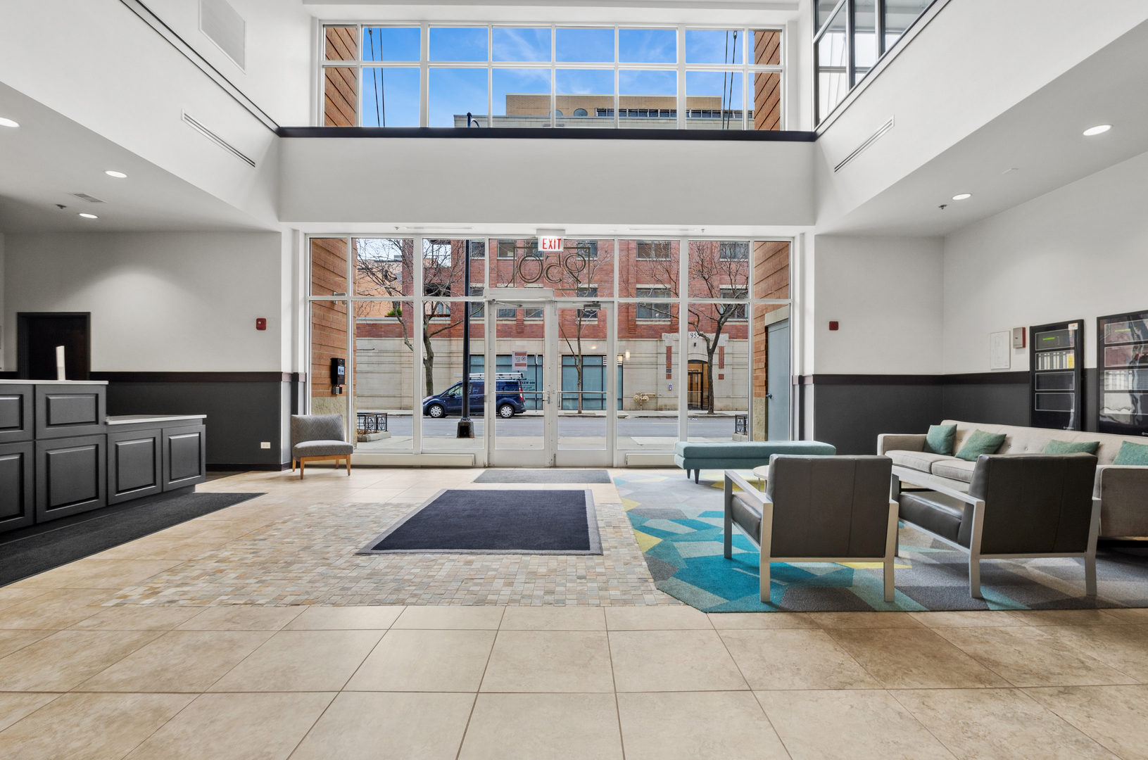 950 West Monroe Street, Unit 809 Chicago, IL 60607 - Photo 3 of 21 a living room with couches a coffee table and kitchen view with wooden floor