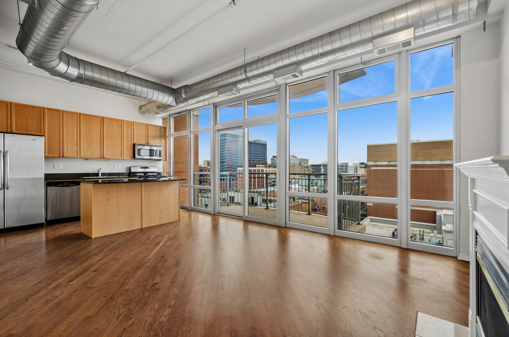 950 West Monroe Street, Unit 809 Chicago, IL 60607 - Photo 5 of 21 a view of a living room with stainless steel appliances wooden floor and a window