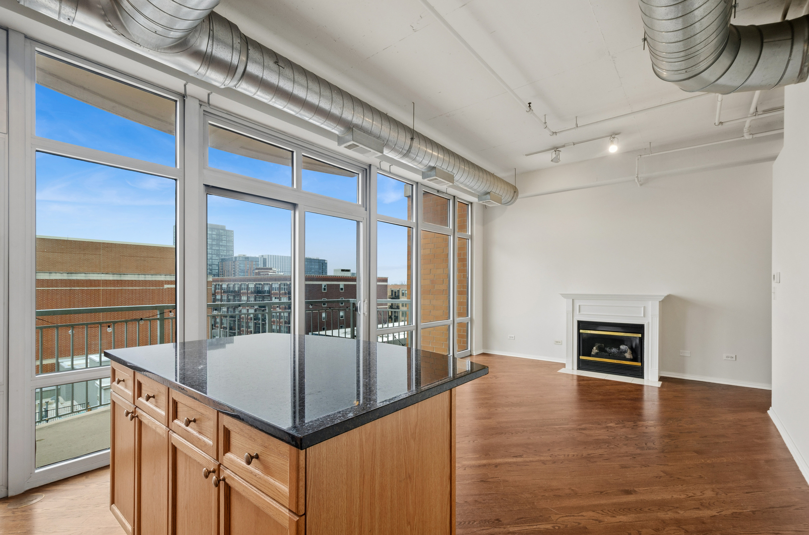 950 West Monroe Street, Unit 809 Chicago, IL 60607 - Photo 9 of 21 a view of a hallway with a dining table and chandelier