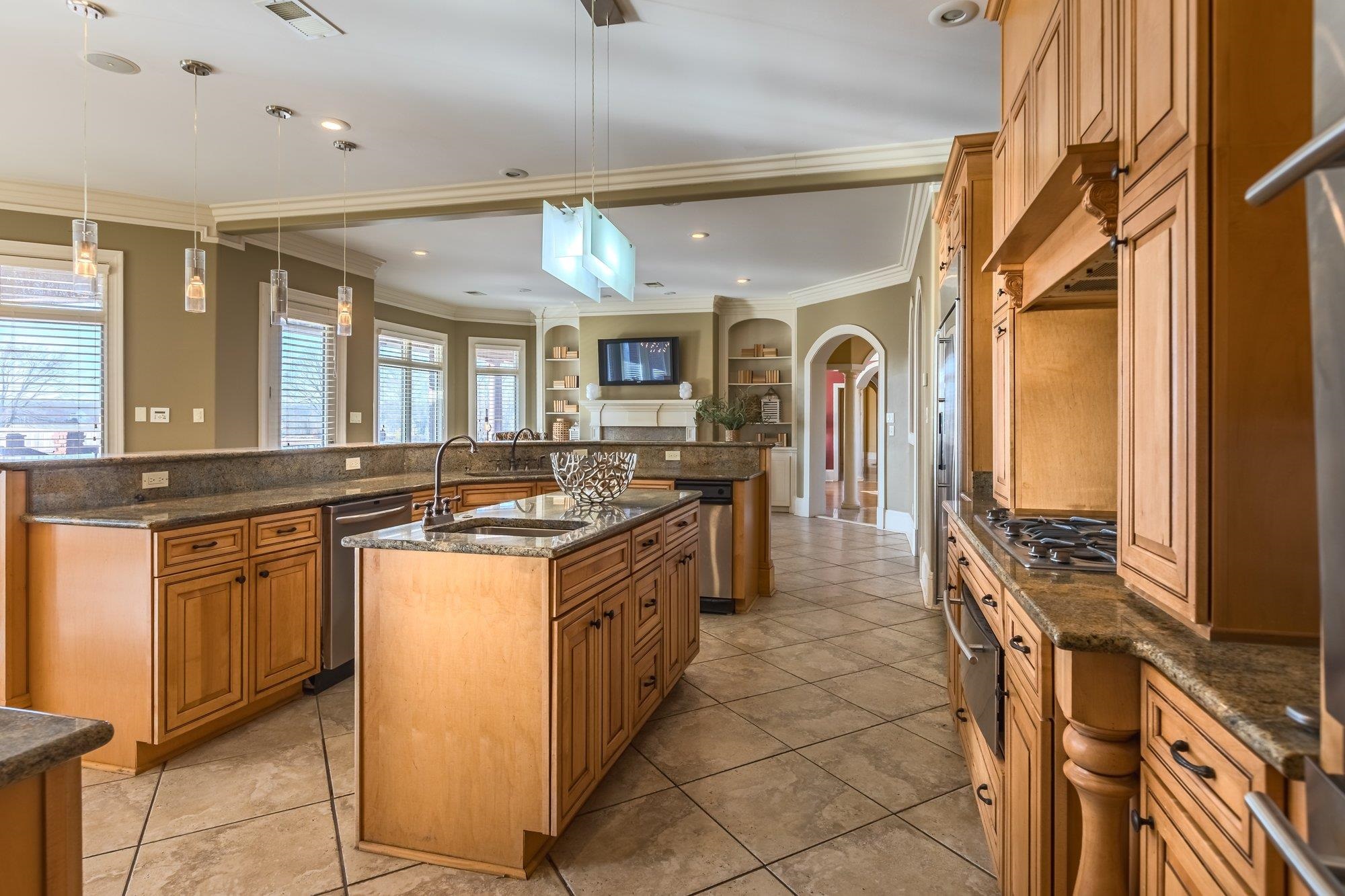 2535 Preakness Drive Eads, TN 38028 - Photo 12 of 34 a large kitchen with stainless steel appliances granite countertop a stove and a sink