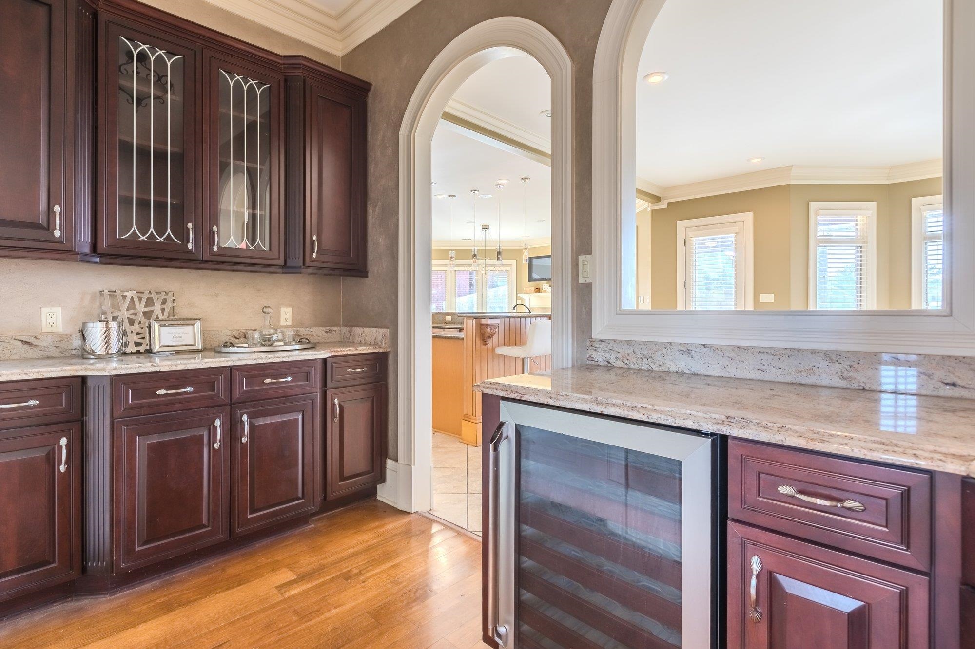 2535 Preakness Drive Eads, TN 38028 - Photo 20 of 34 a kitchen with stainless steel appliances granite countertop wooden cabinets a sink and dishwasher with a large window