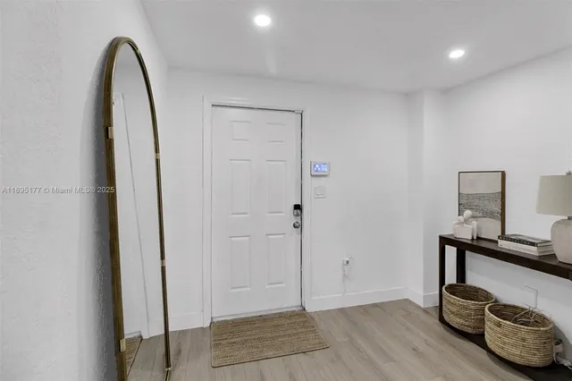 a view of room with furniture and wooden floor