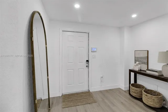 a view of room with furniture and wooden floor