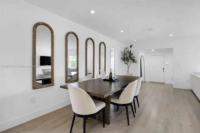 a dining room with furniture and window