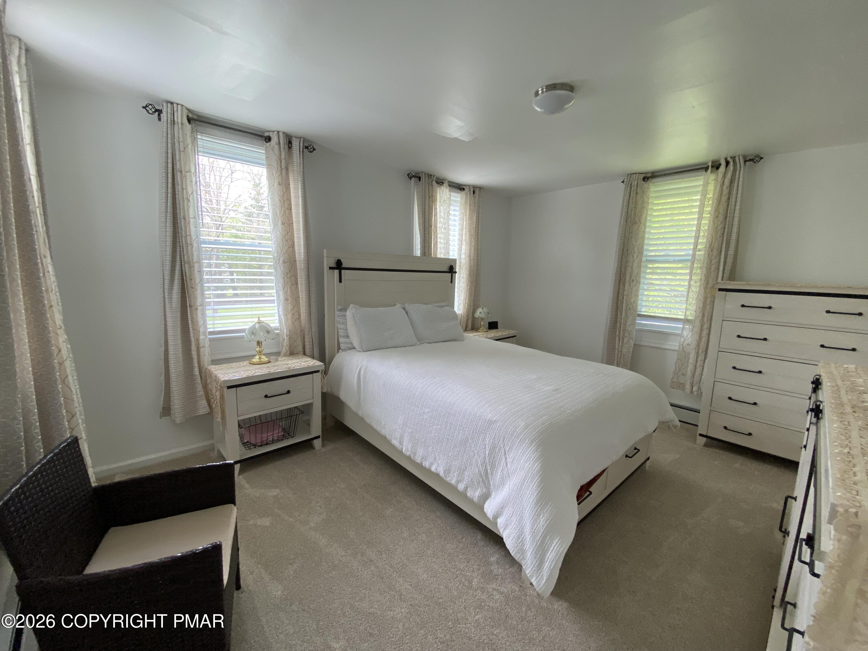 565 Cherry Lane Road East Stroudsburg, PA 18301 - Photo 16 of 16 a bedroom with a bed and a window