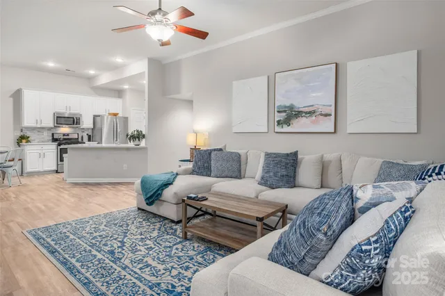 a living room with furniture and a rug