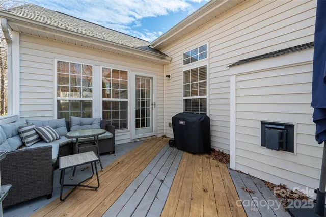 a view of balcony with couch and wooden floor