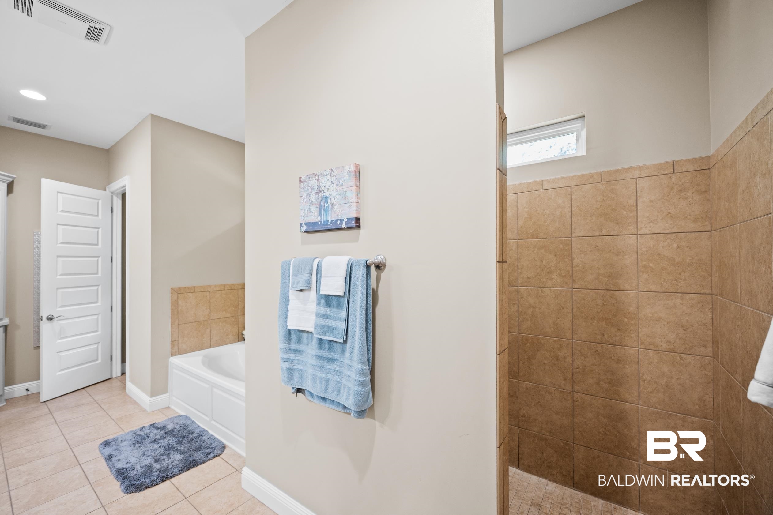9060 Bromley Road Bay Minette, AL 36507 - Photo 33 of 63 Bathroom featuring tile patterned floors, a garden tub, and tiled shower