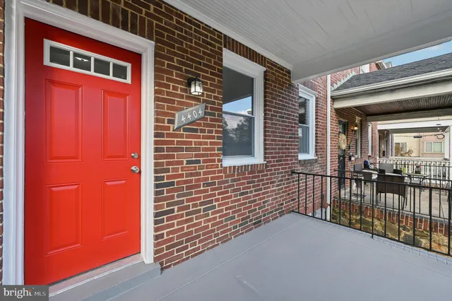 a view of a brick house with many windows