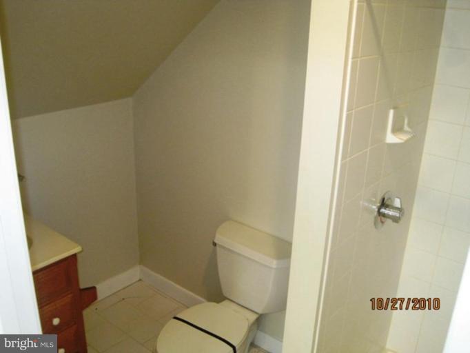 355 Rt 28 Berkeley Springs Berkeley Springs, WV 25411 - Photo 17 of 24 a bathroom with a toilet and a shower